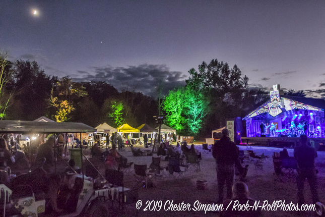 Sleepy Creek stage and area at night with a crescent moon above.Mama Corn